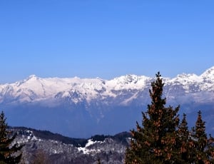 snow covered mountain during daytime thumbnail