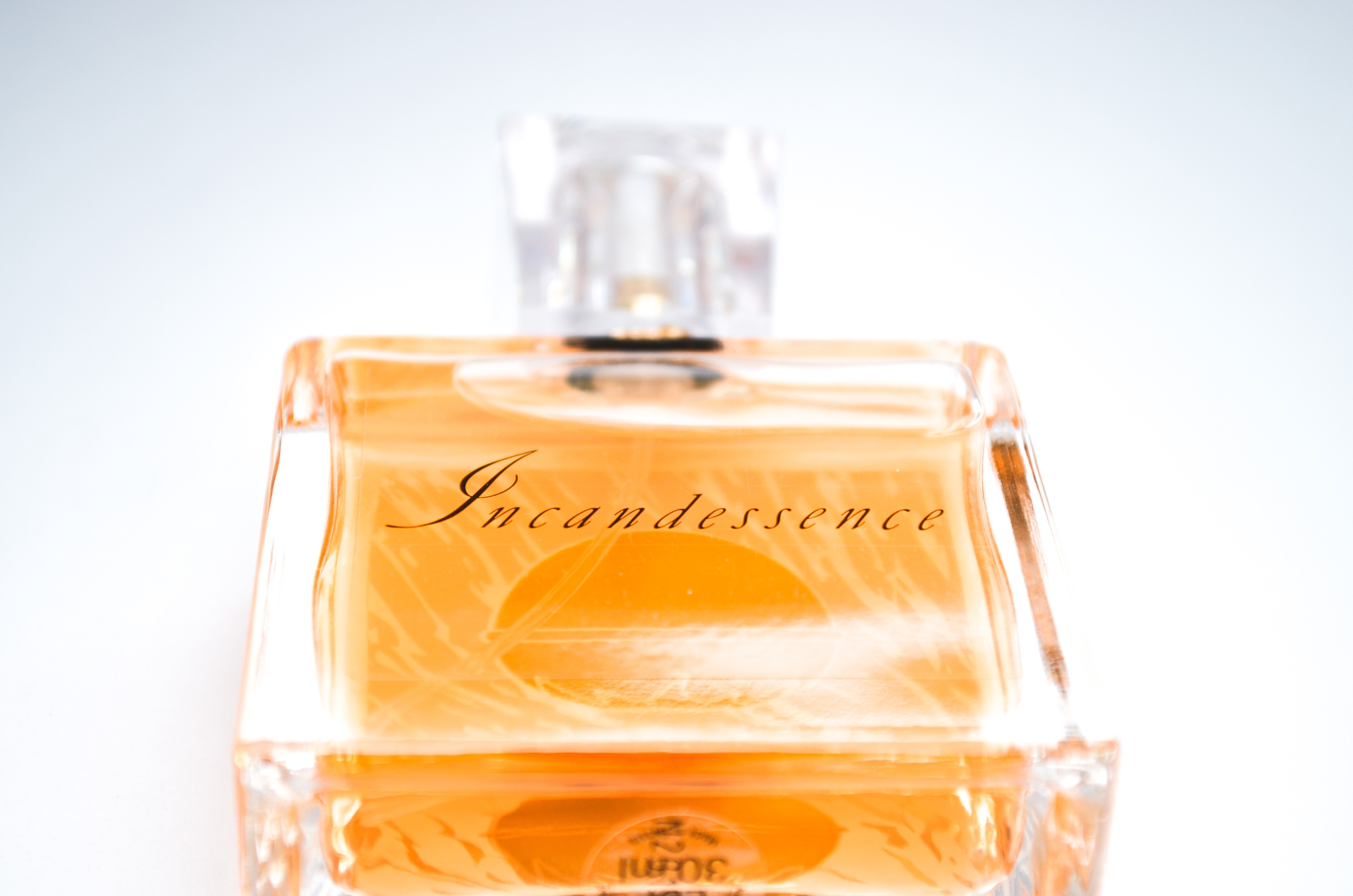 Incandessence perfume bottle with white background