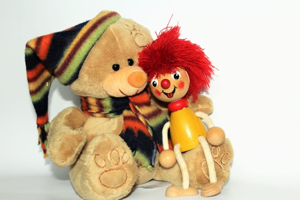 teddy bear and red haired wooden doll preview