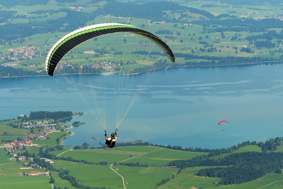 green white and black paragliding preview
