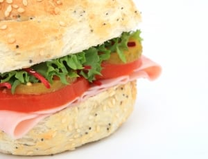 brown tomato, ham and lettuce sandwich in closeup shot thumbnail