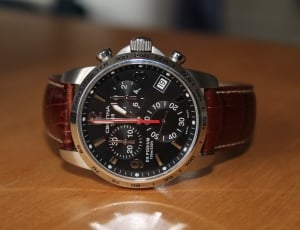 brown leather strap silver and black round chronograph watch thumbnail