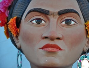 woman face wooden statuette thumbnail