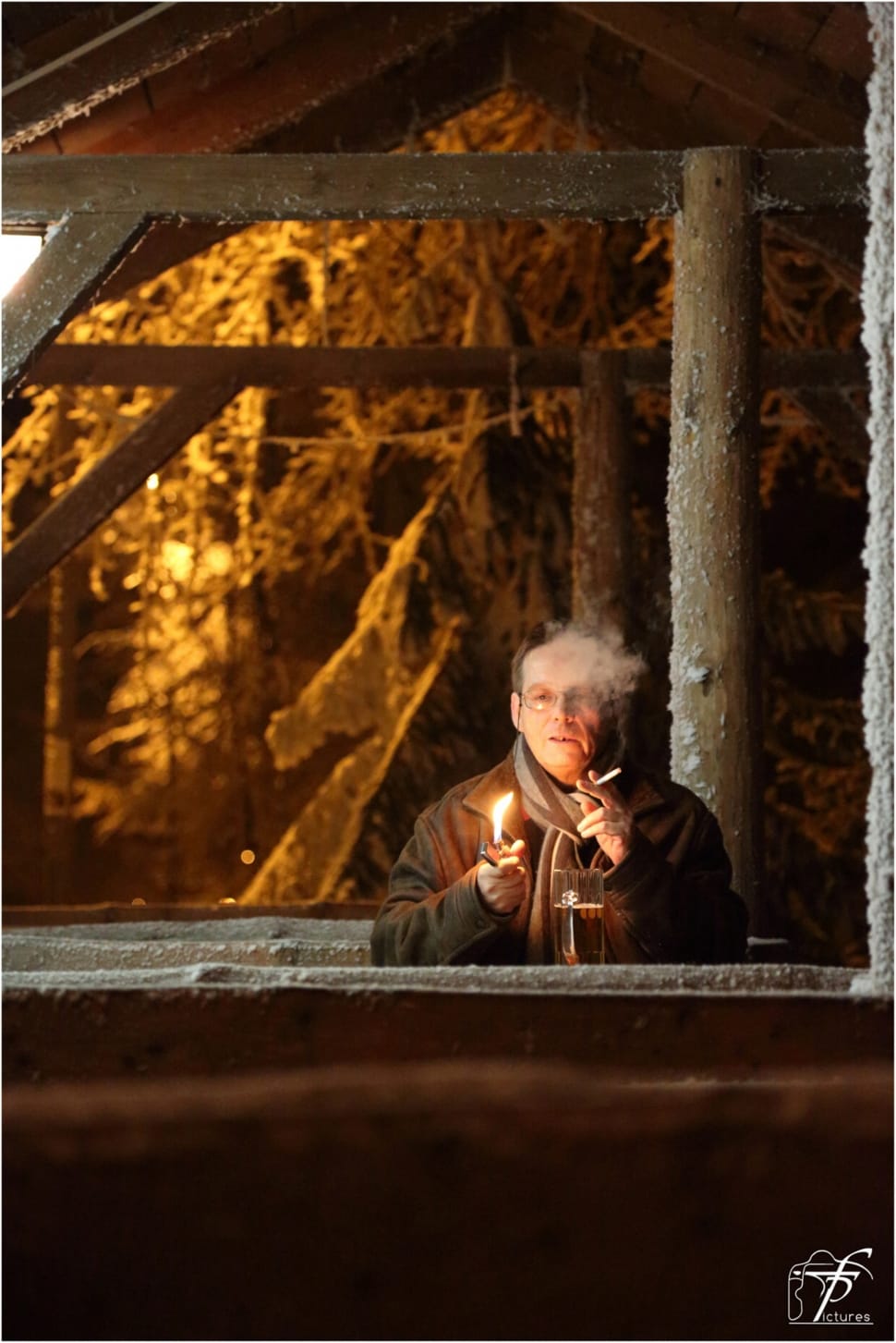 man in brown coat smoking cigar under the brown wooden shelter preview