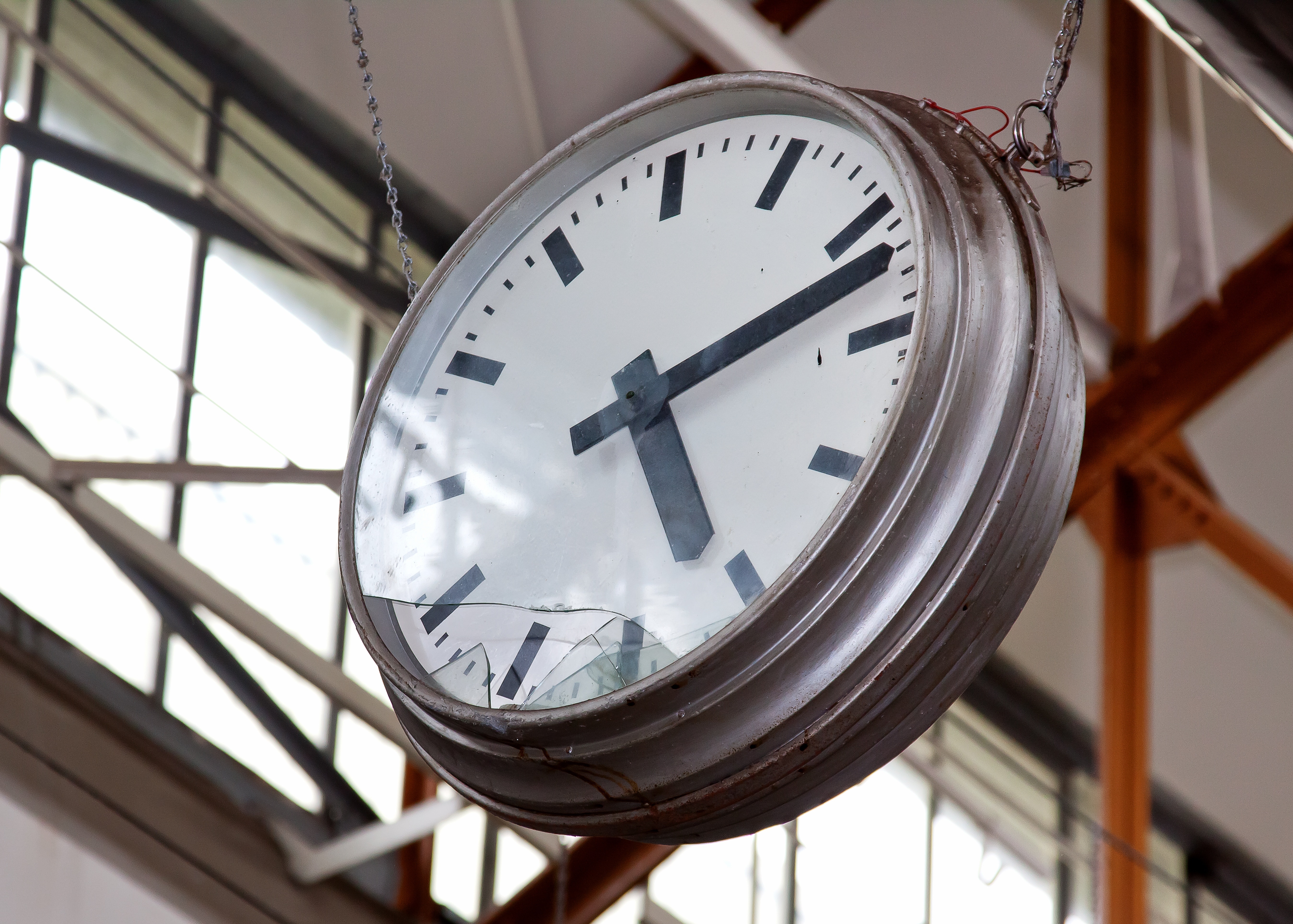 silver round analog train clock