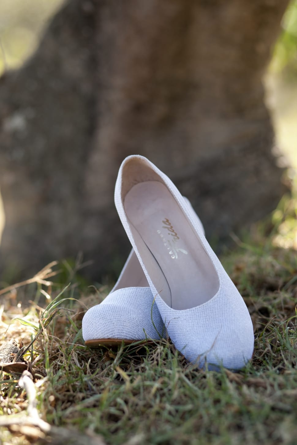 women's pair of white flat shoes preview