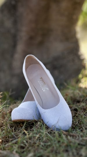 women's pair of white flat shoes thumbnail