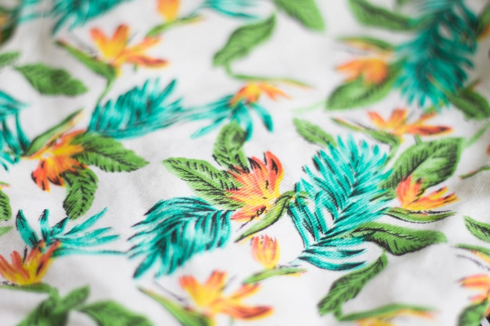 white, teal, and orange floral textiel preview