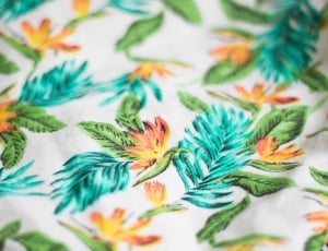 white, teal, and orange floral textiel thumbnail
