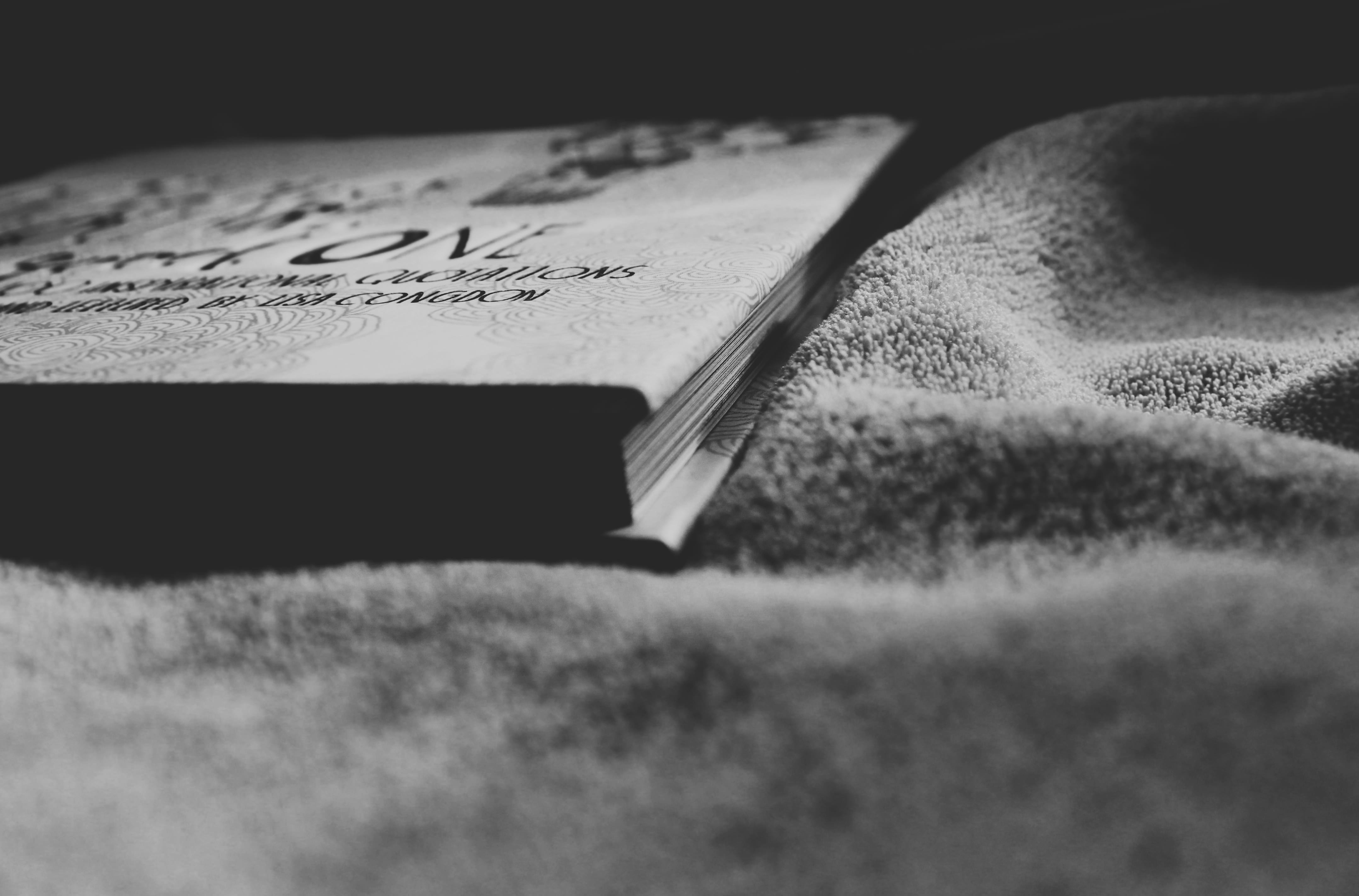 gray textile and book