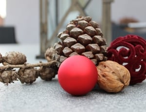 red ball, wallnut and pinecone decorations thumbnail