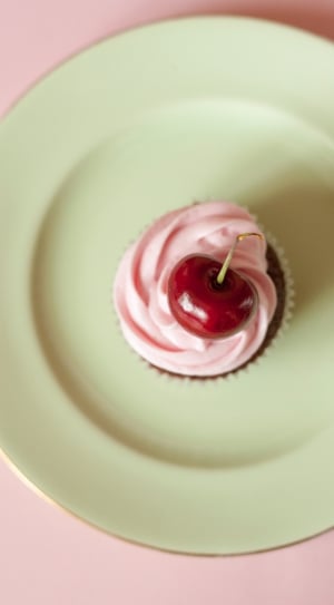 cherry cupcake on green ceramic plate thumbnail