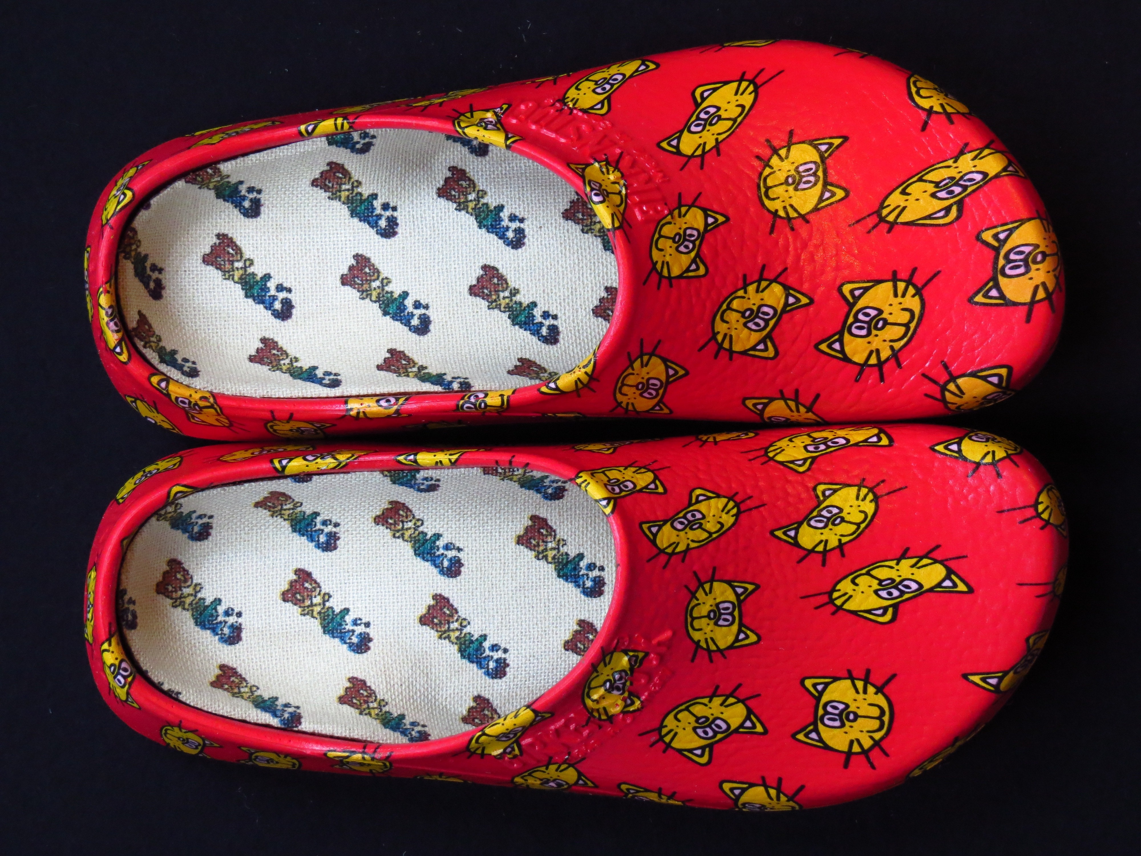 red and yellow cat print rubber clogs