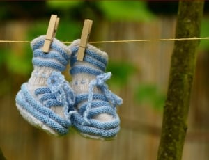 pair of girl's blue and white knitted shoes thumbnail