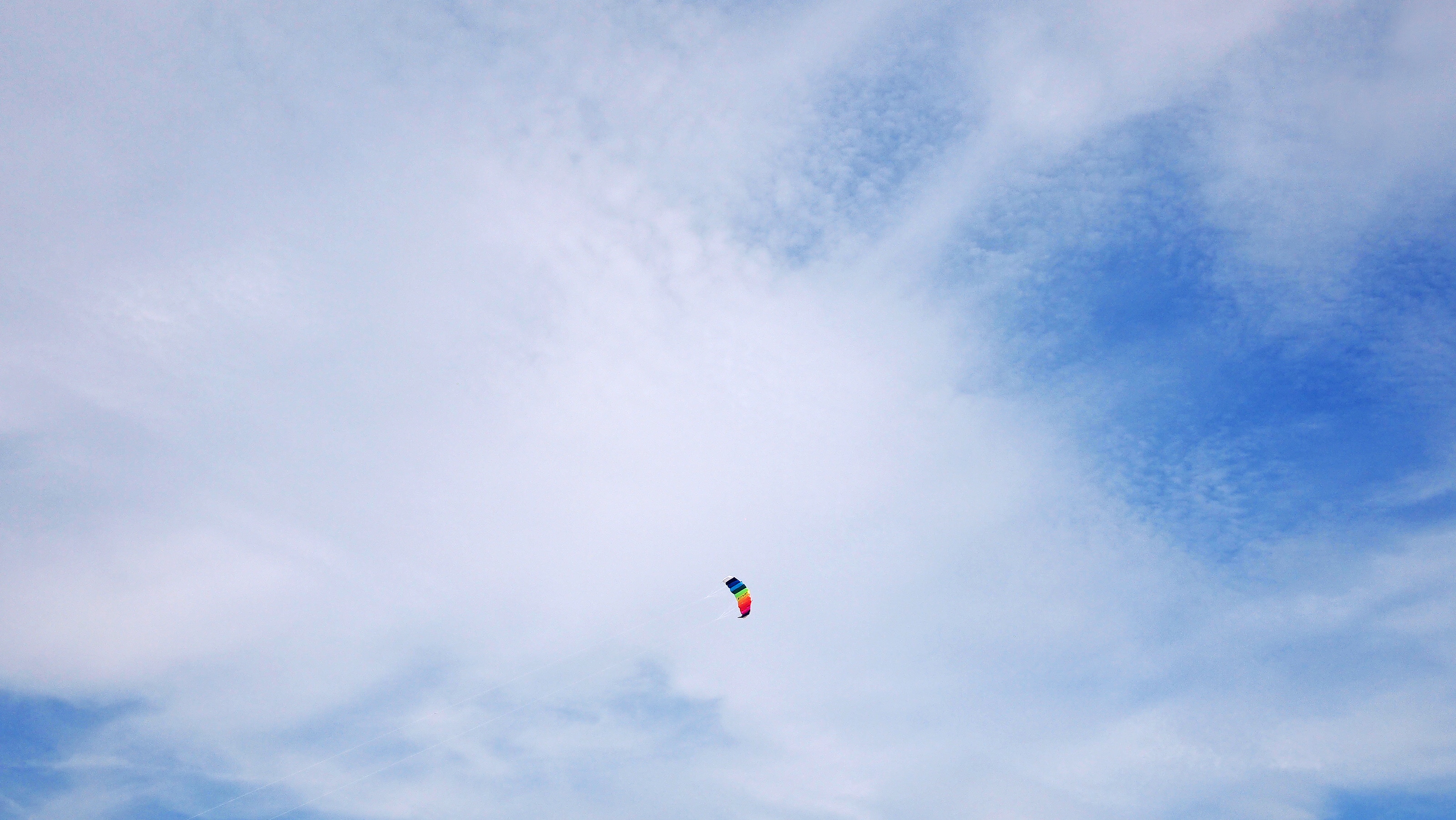 blue white and red paraglider
