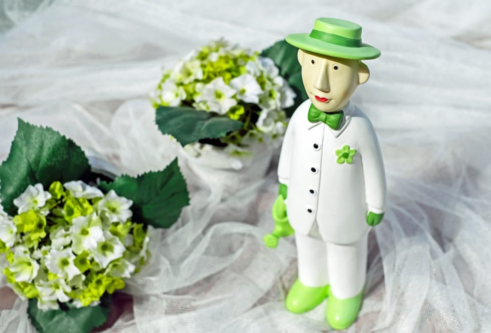 man in green hat and white dress shirt and pants ceramic figurine preview