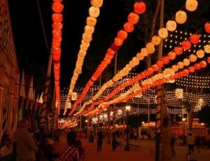 red and yellow festival lantern hanging during nighttime thumbnail