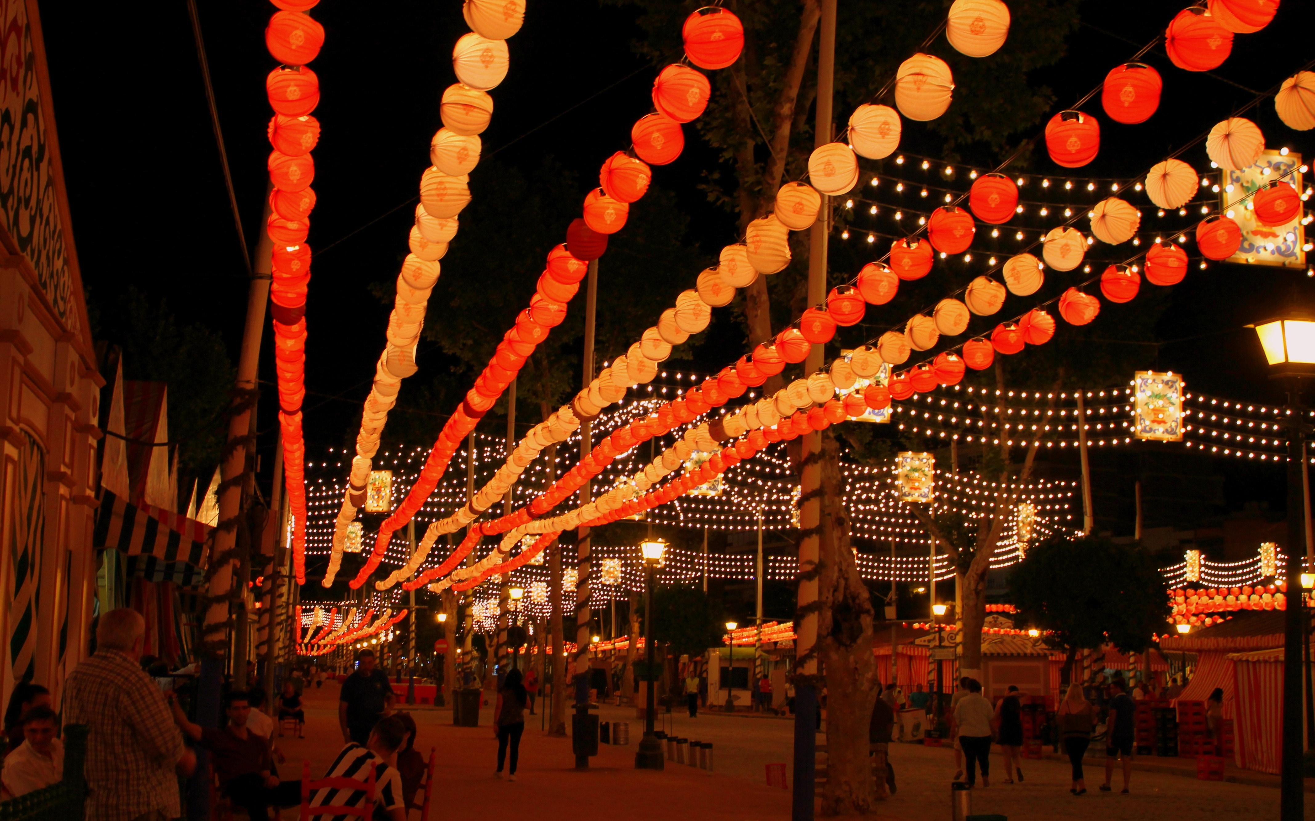 red and yellow festival lantern hanging during nighttime