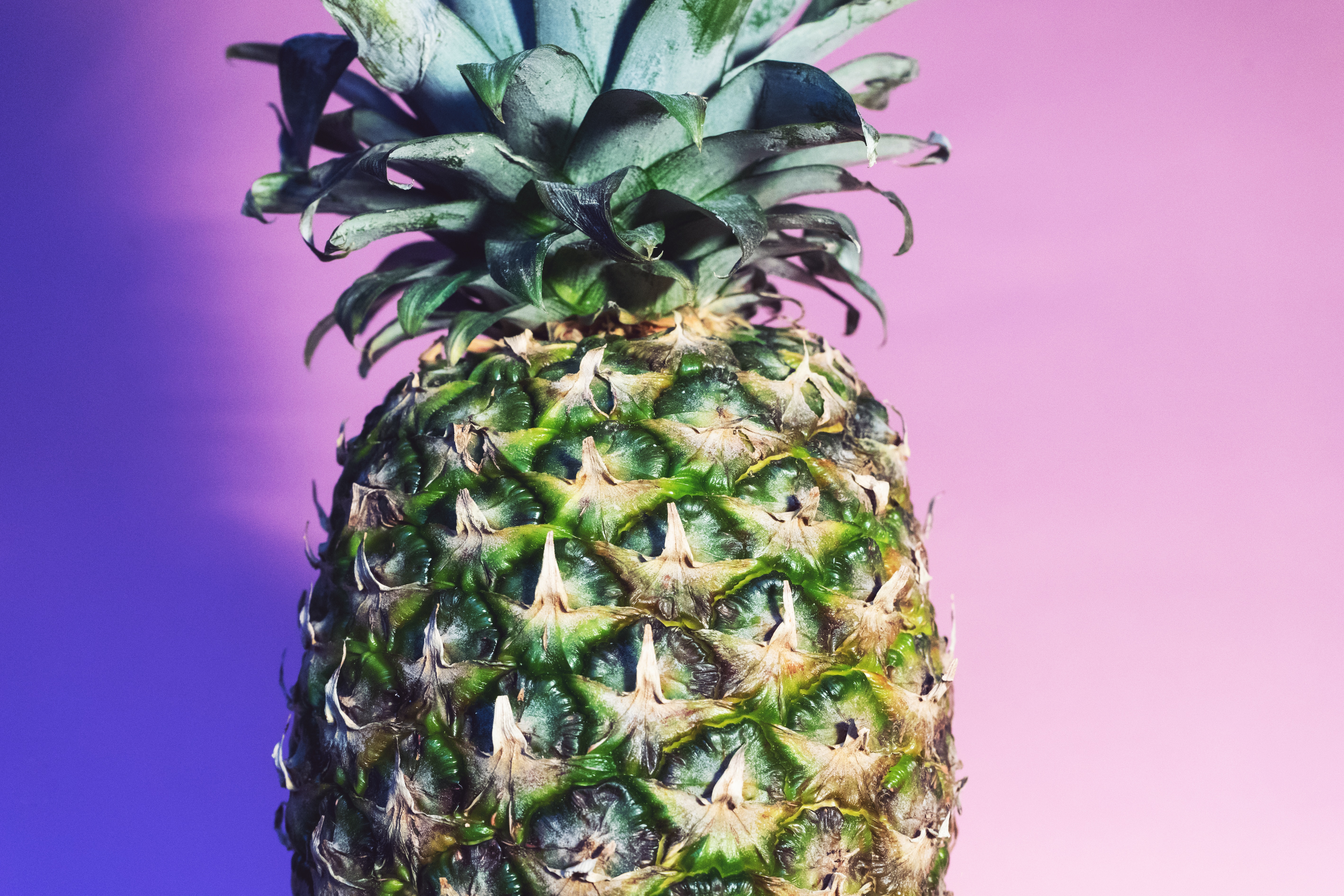 shallow focus photography of unripe pineapple