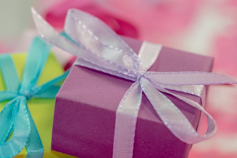two green and purple gift boxes preview