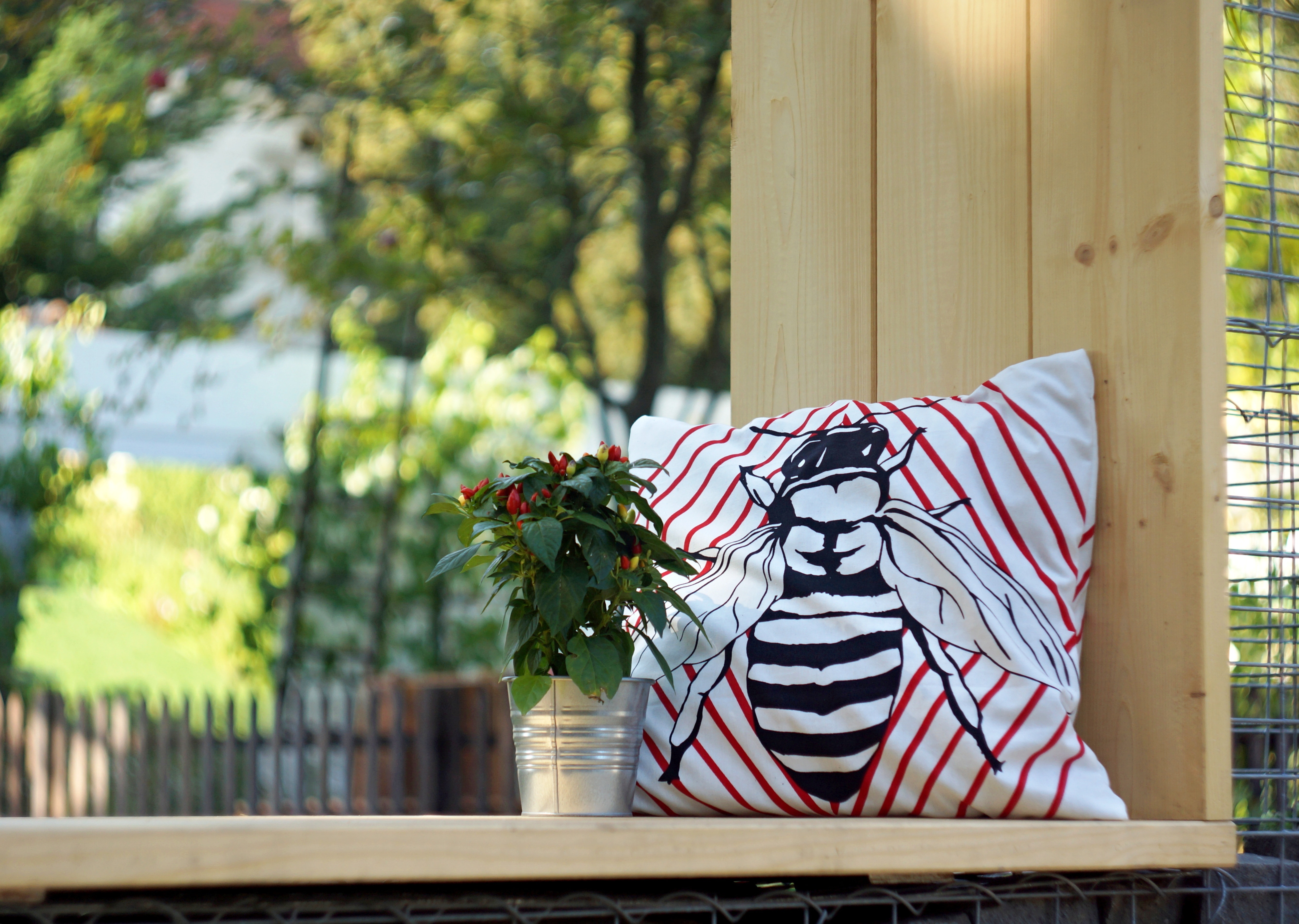 white red and black bee print throw pillow