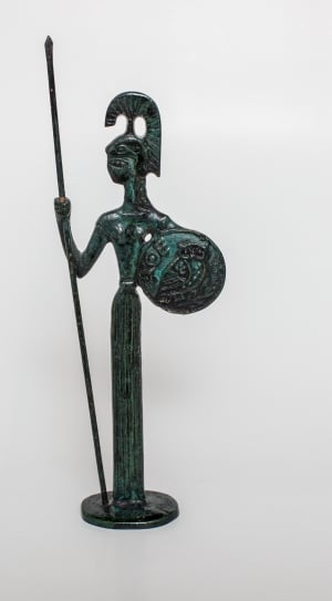 person holding spear and shield figurine thumbnail