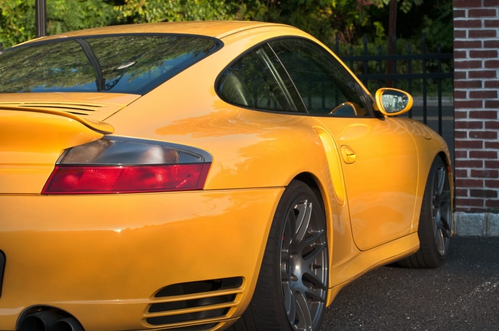 yellow porsche cayman 911 preview