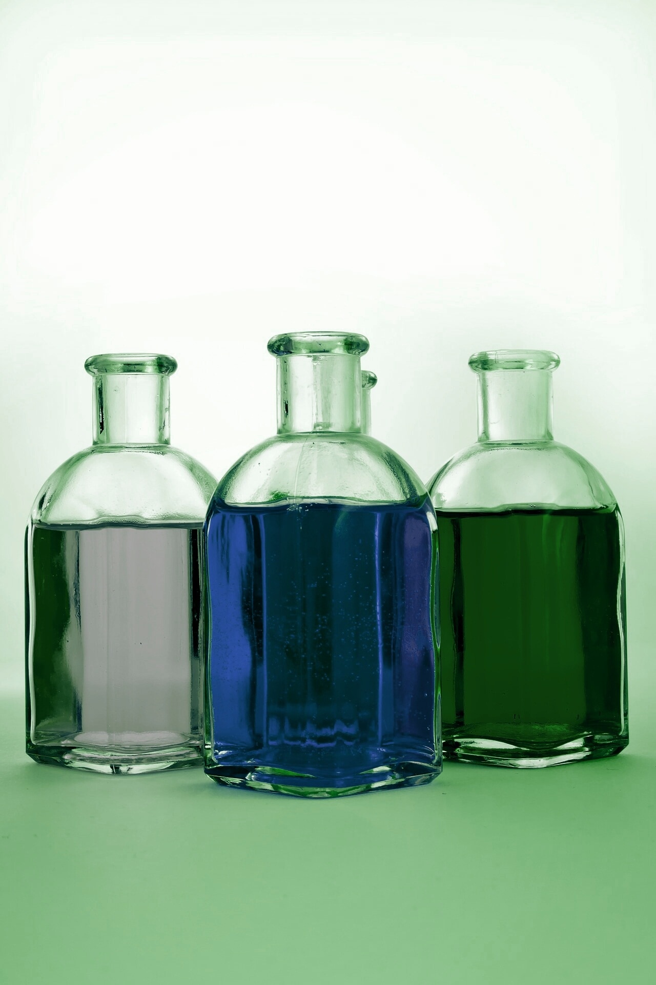3 clear glass bottles