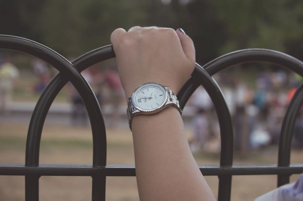 silver and white analog watch with linked strap preview