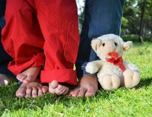 two person wearing jeans with child wearing red jeans thumbnail