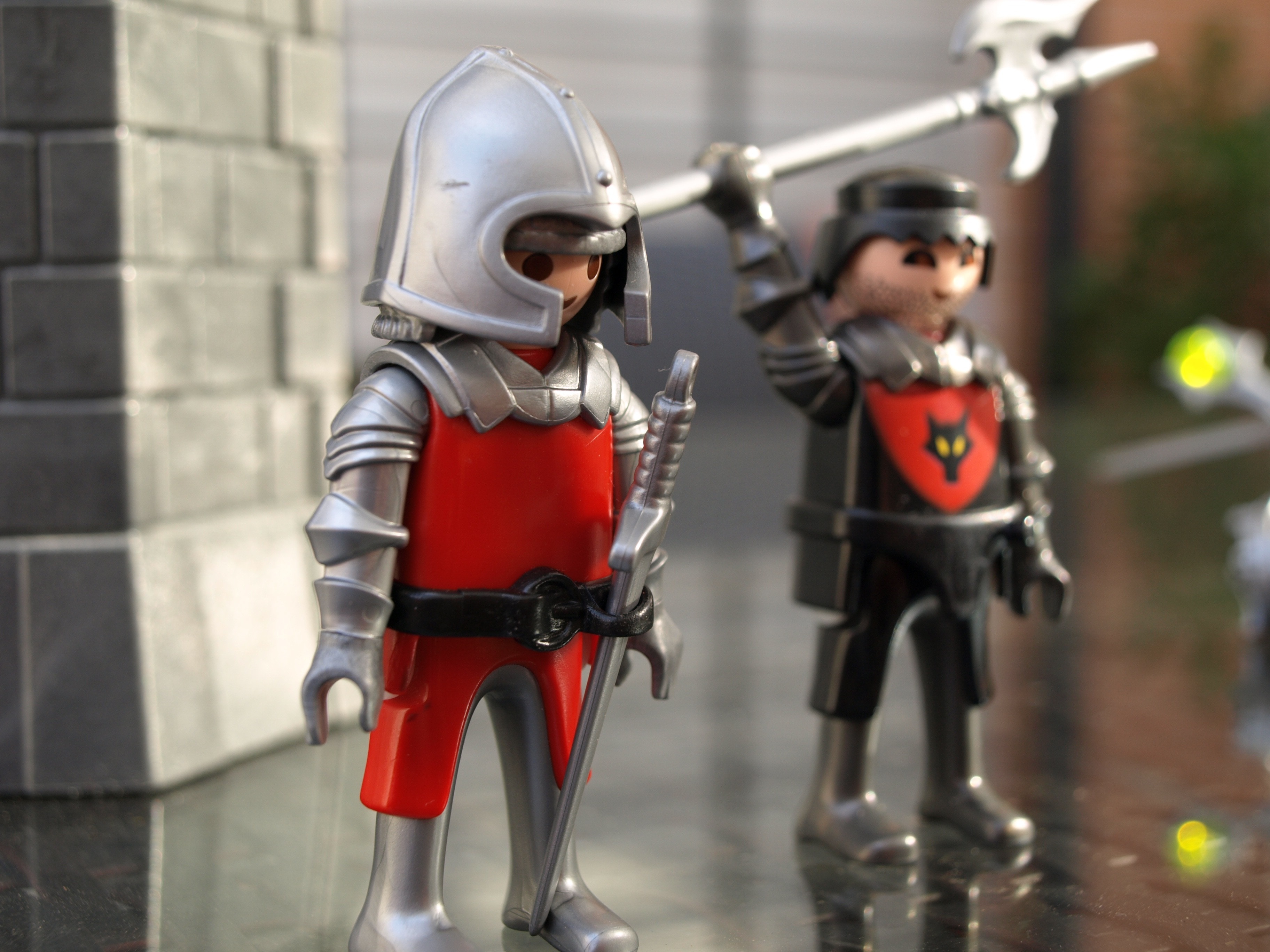 two gray and black knights figures
