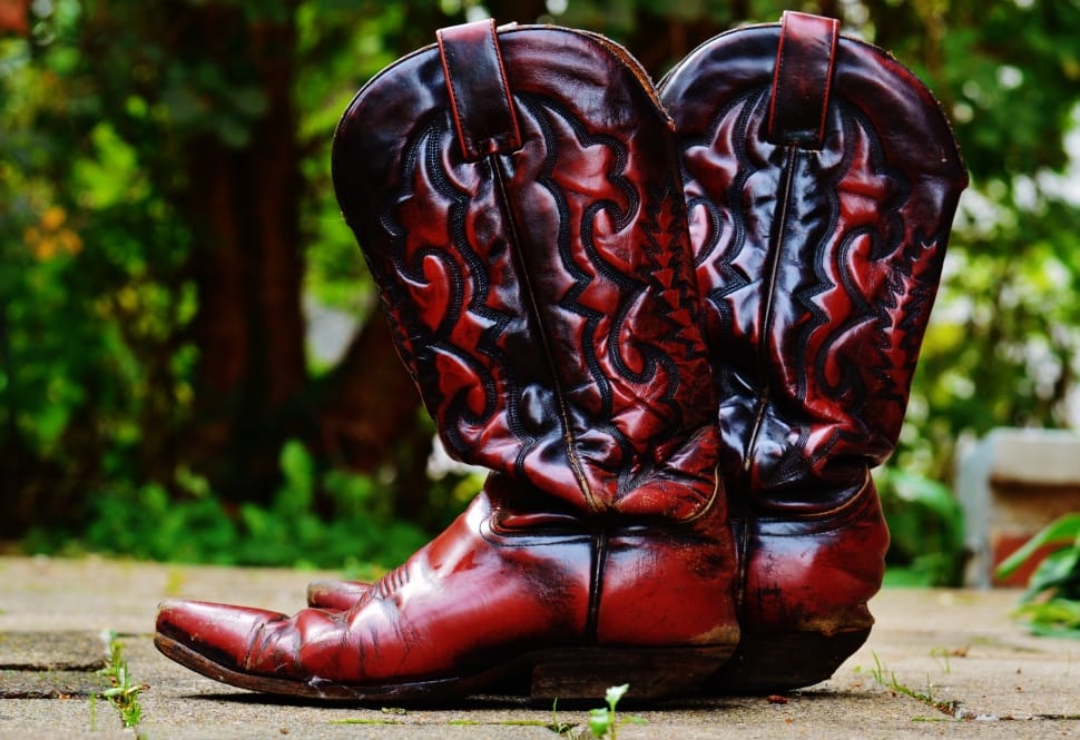 pair of brown leather cowboy boots preview