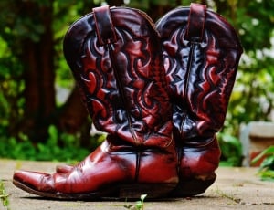 pair of brown leather cowboy boots thumbnail