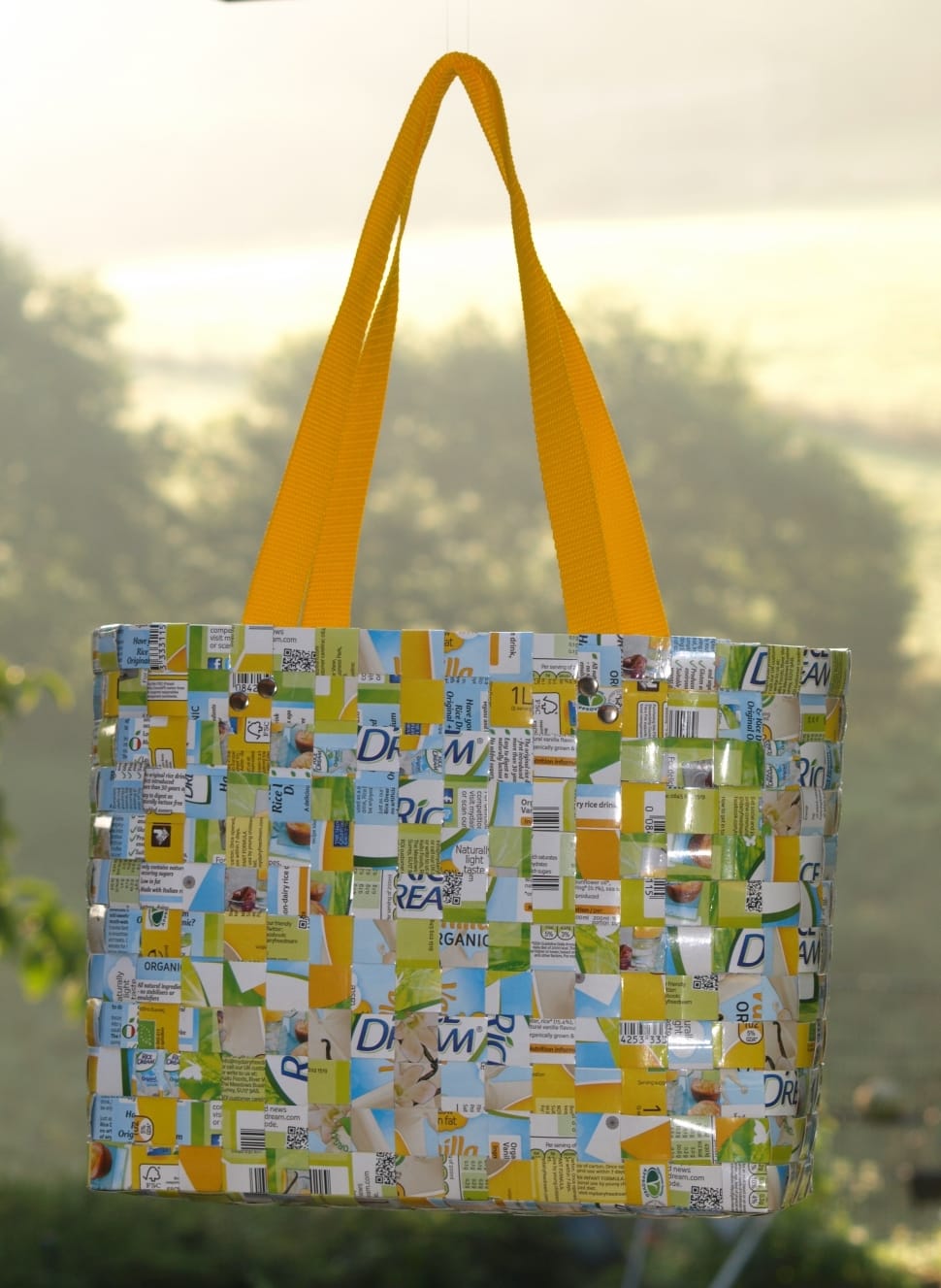 yellow and green recycled bag in focus photography preview
