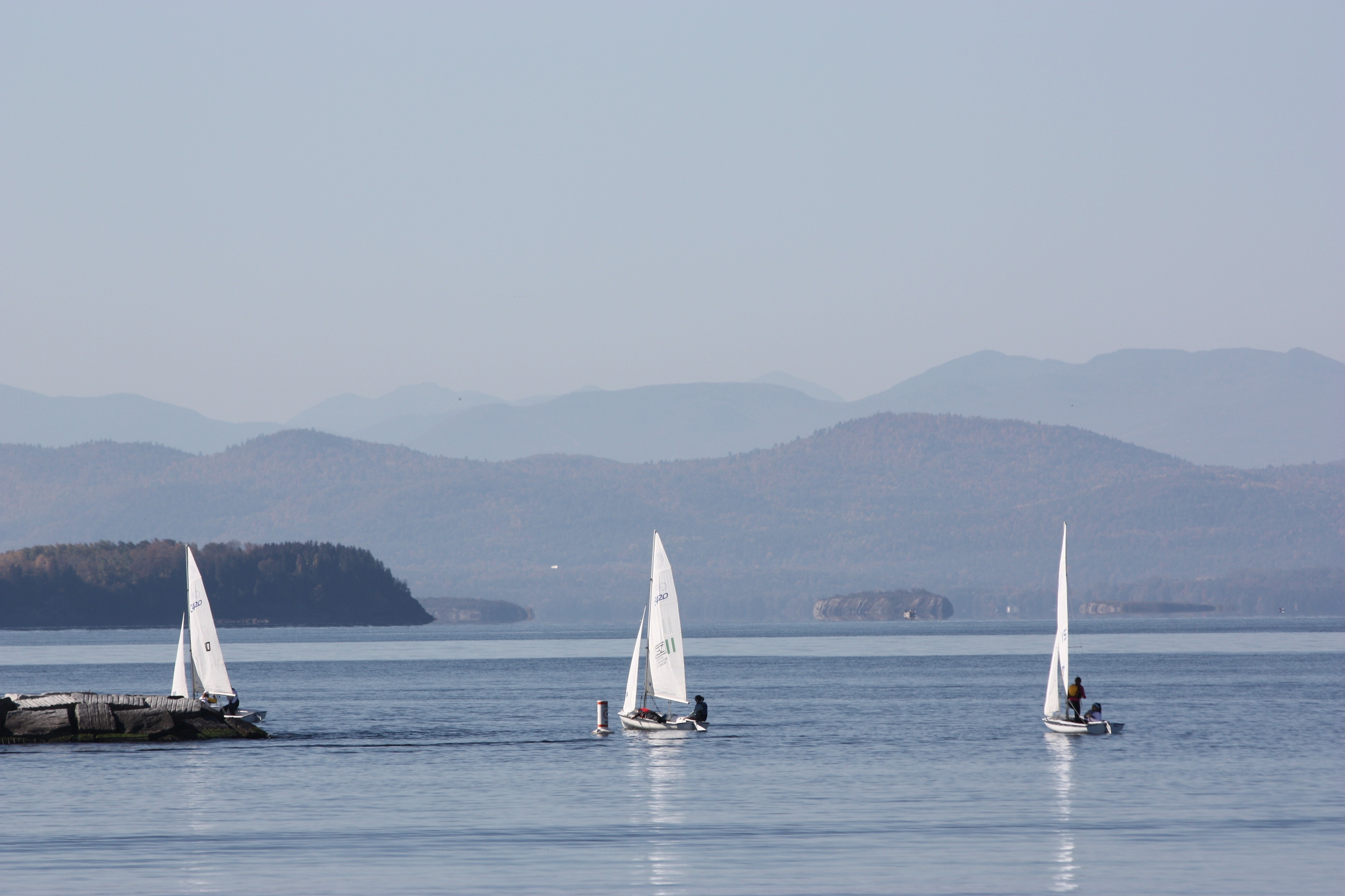 3 white sailboats
