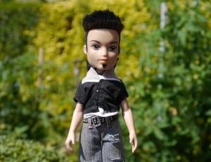 boy doll in black short sleeve shirt and blue pants thumbnail