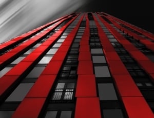 red and black high rise curtain wall building thumbnail