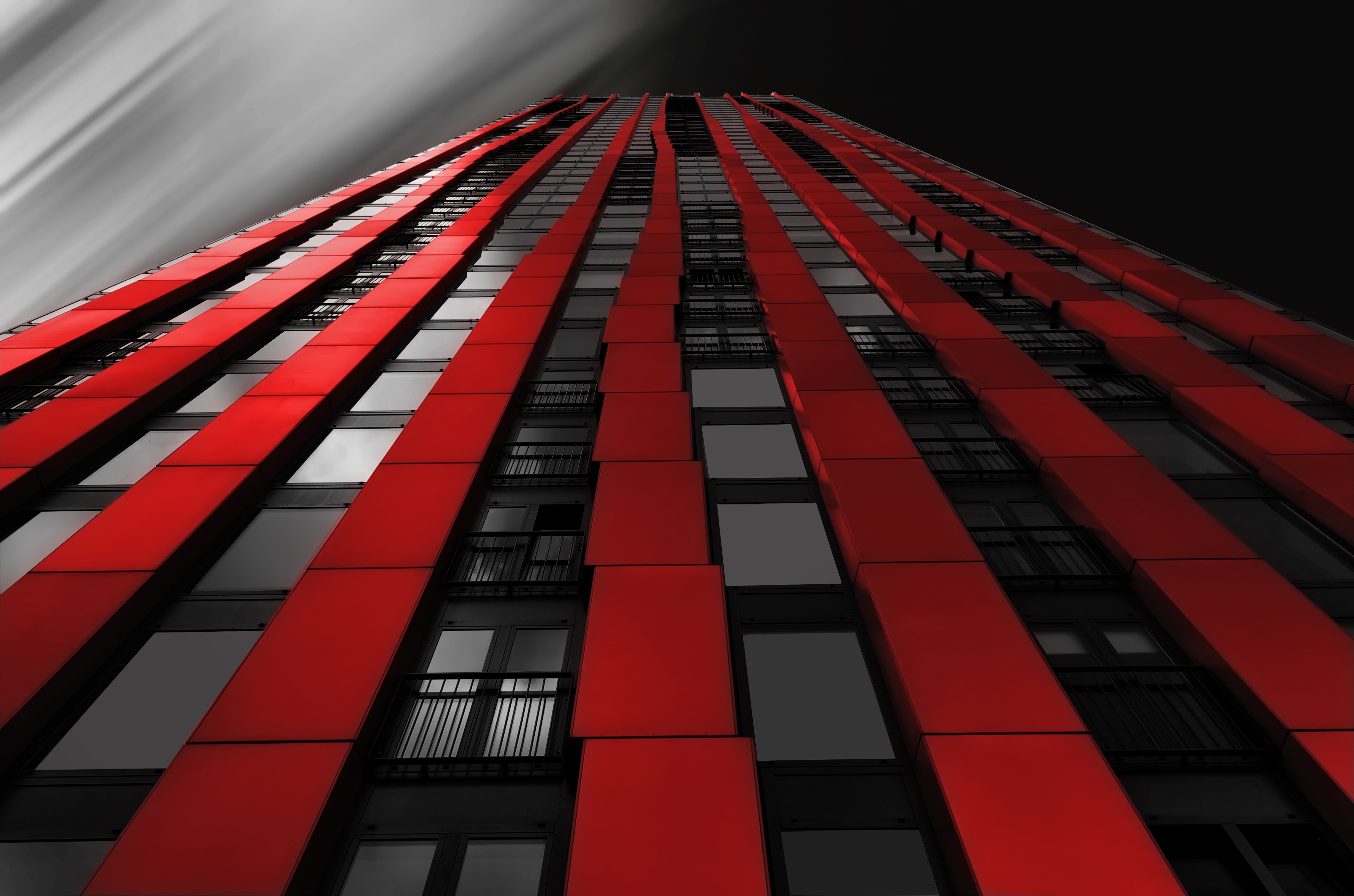 red and black high rise curtain wall building