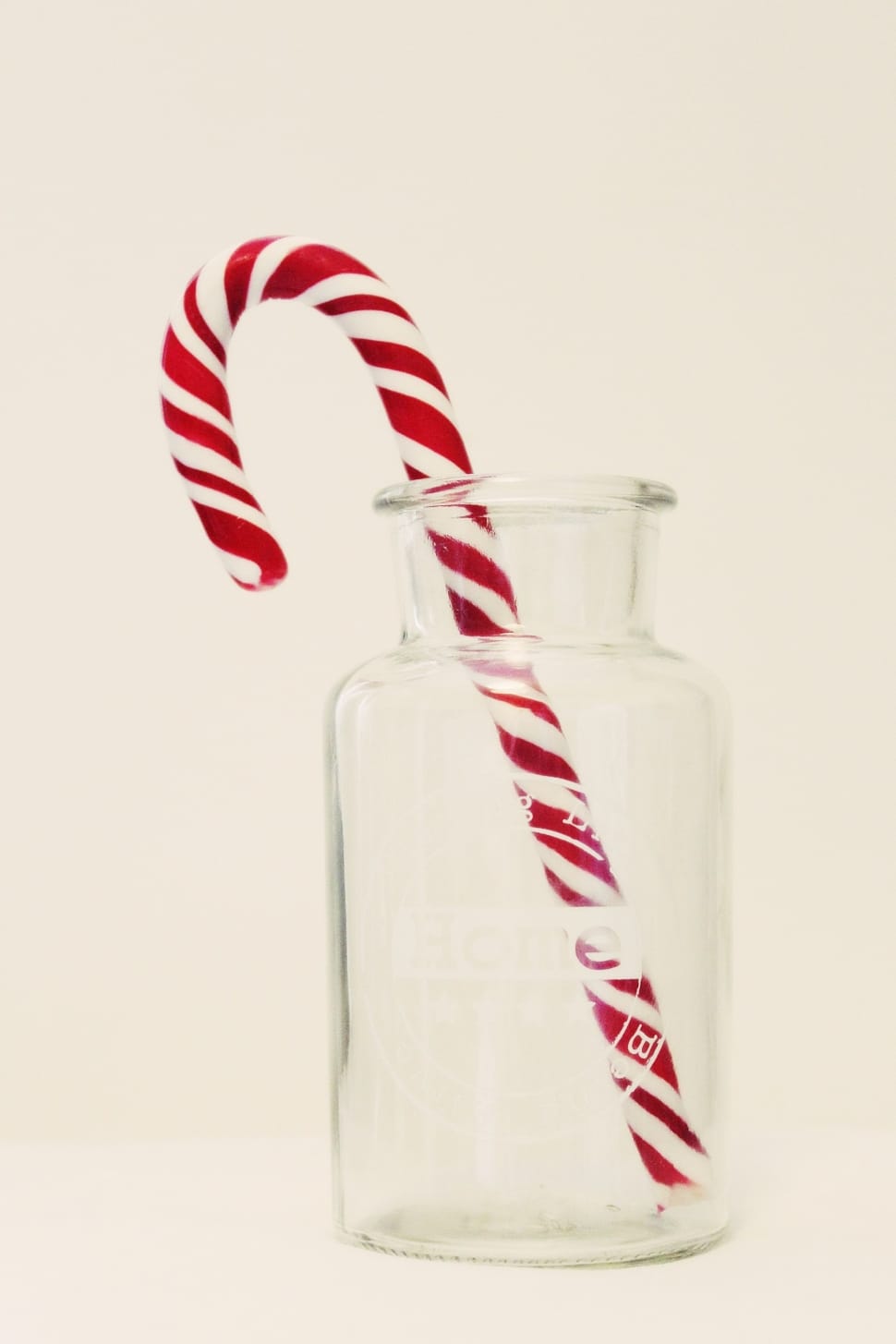 red and white candy cane and clear glass bottle preview