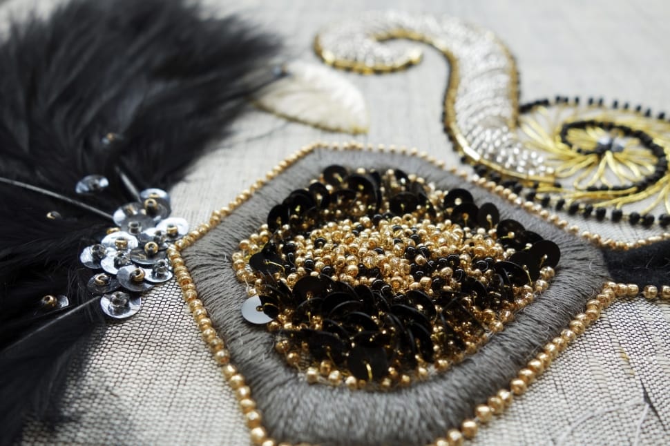 gray and yellow beaded accessory preview