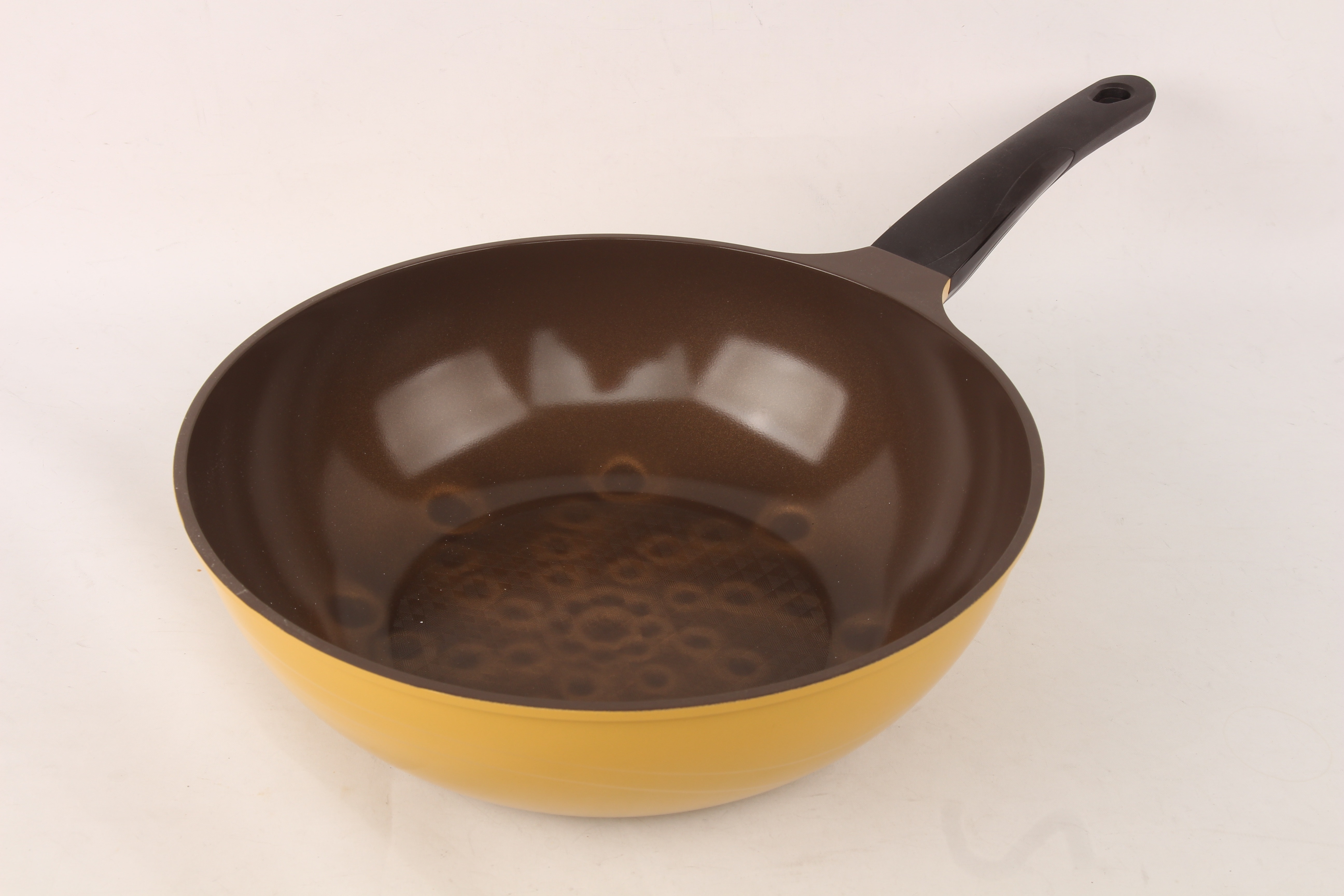 yellow and black handled pan