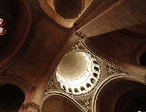 low angle photography of brown concrete cathedral interior thumbnail