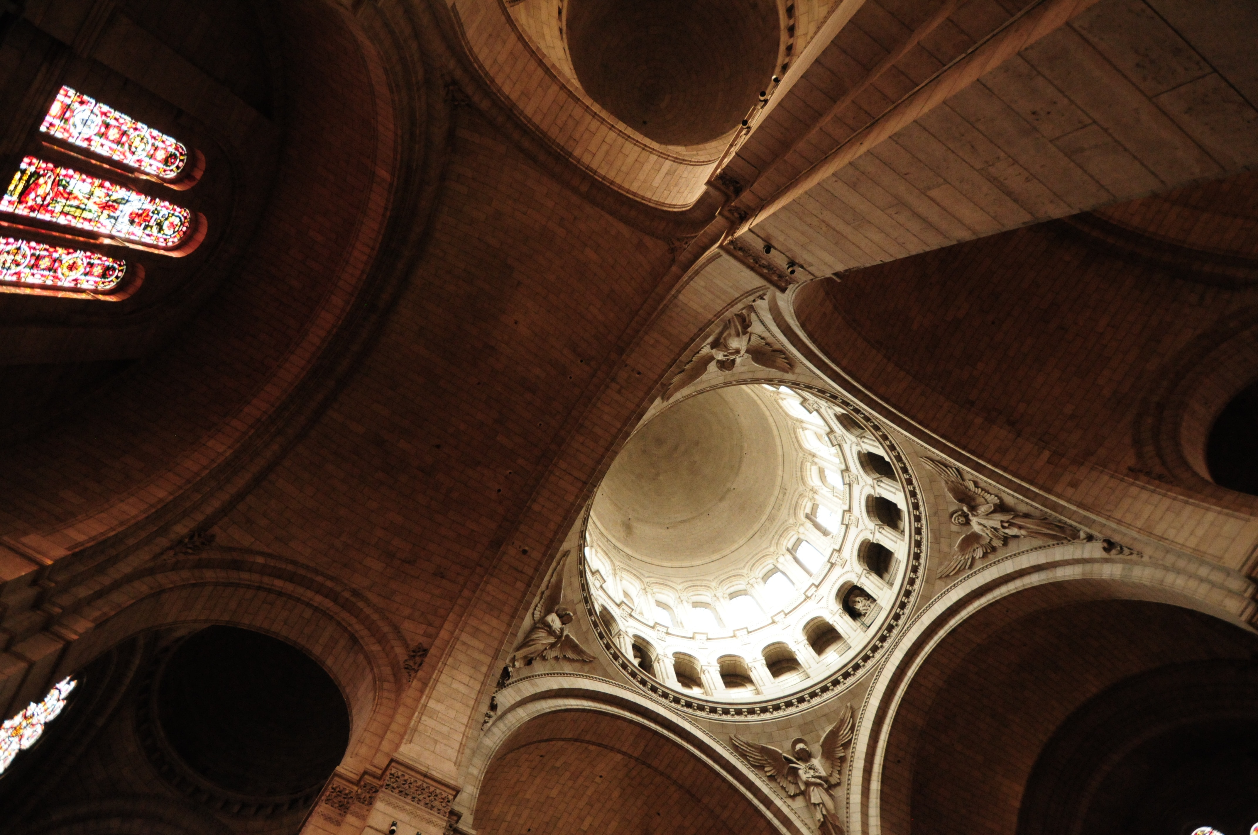 low angle photography of brown concrete cathedral interior