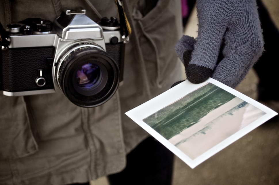 black and gray instant camera with photo preview