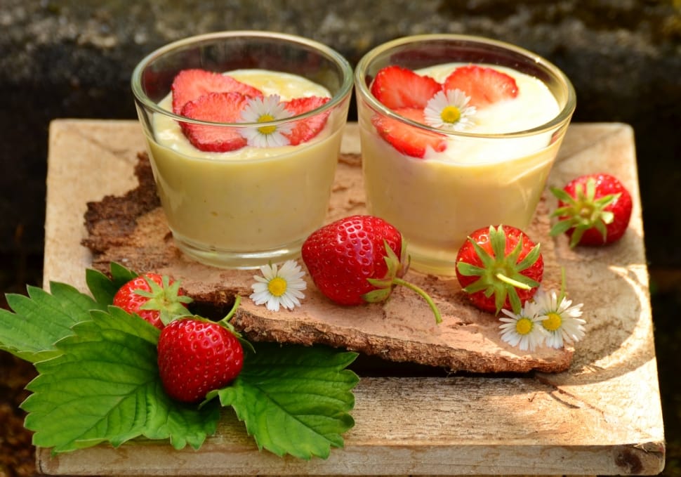 strawberries and 2 milk filled clear shot glasses preview