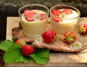 strawberries and 2 milk filled clear shot glasses thumbnail
