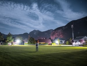 photo of man in grassland during nightime thumbnail