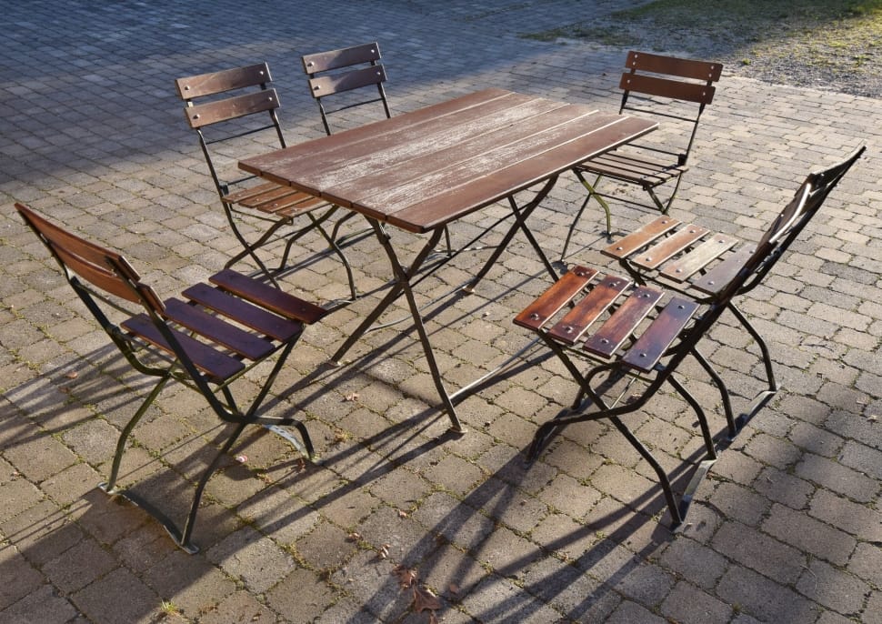 brown wooden table with 6 wooden armless chairs preview