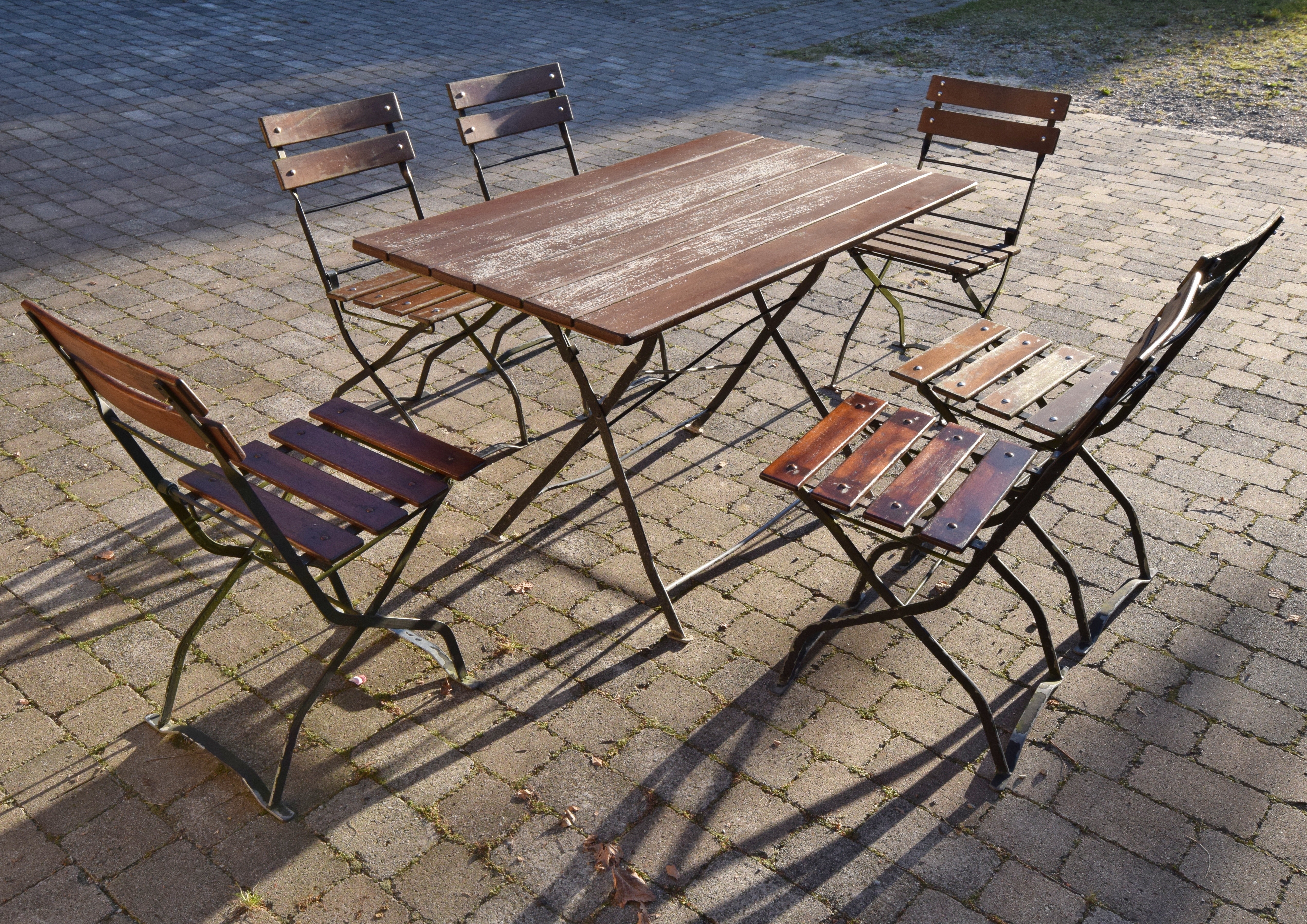 brown wooden table with 6 wooden armless chairs