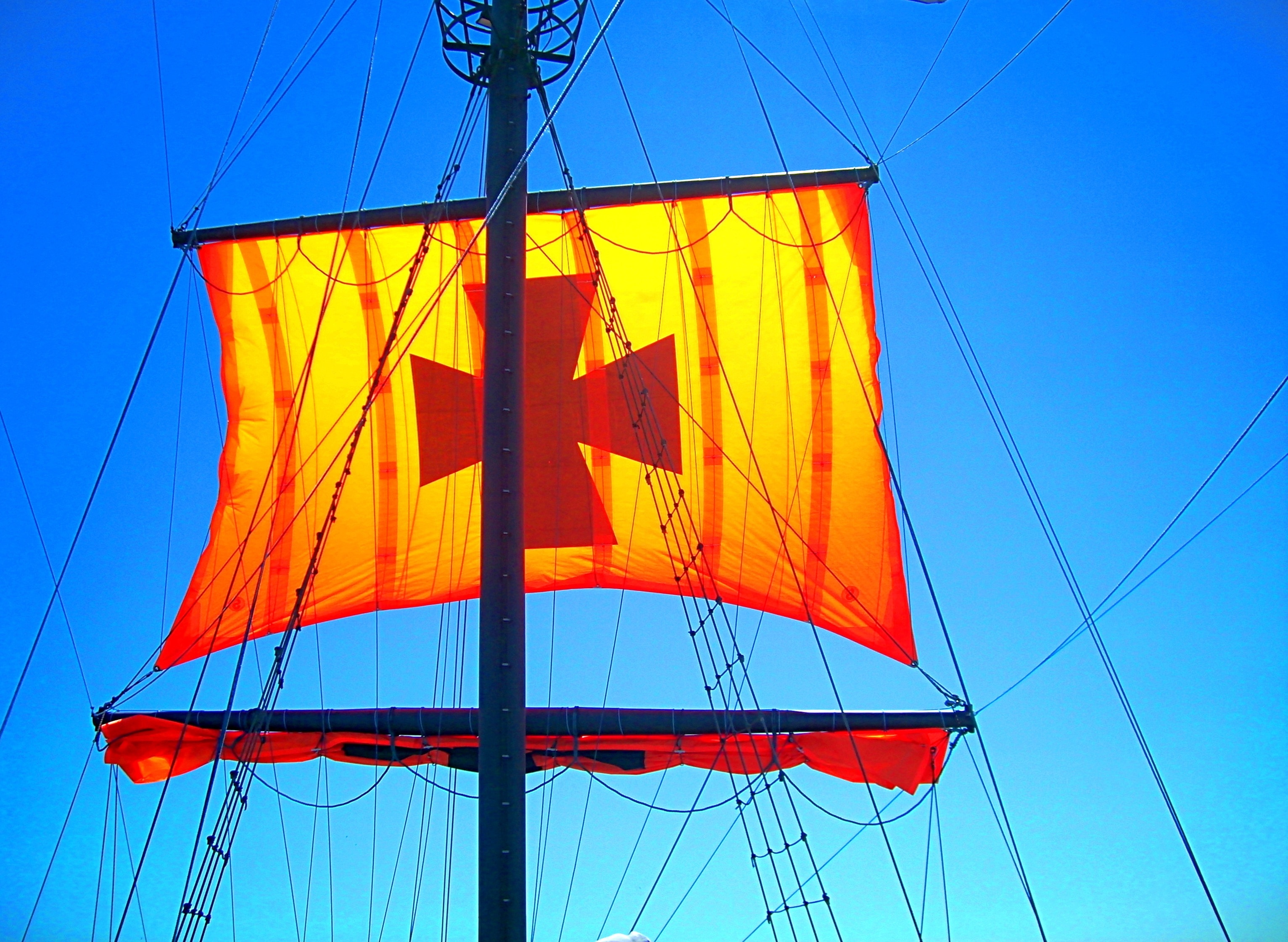 brown cross printed boat sailings